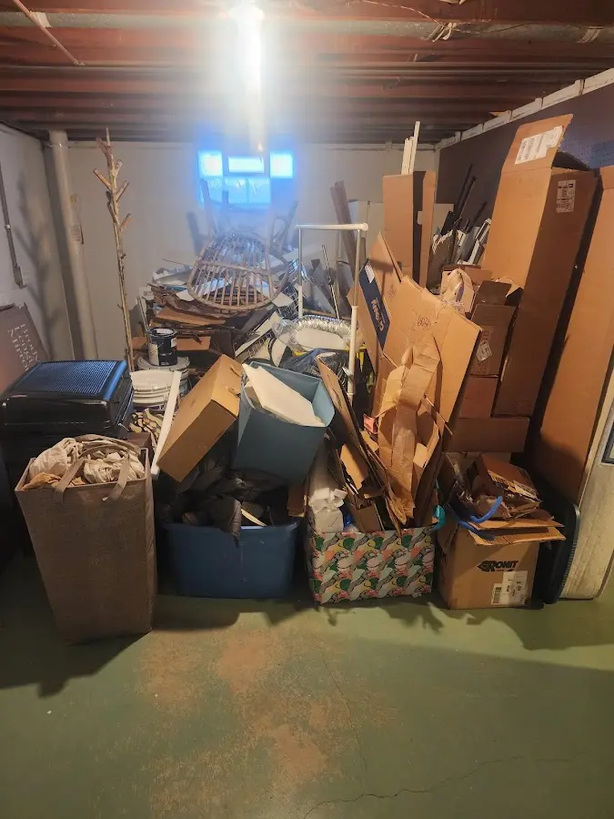 Roll-off dumpster container at job site for 20 Yard Dumpster Rental in Weare